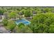 Aerial view of community tennis courts nestled among lush green trees and offering recreational opportunities at 400 W Rosemary St # 104, Chapel Hill, NC 27516