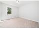 Vacant bedroom with carpet, natural light, and neutral tones, ready for personalization and comfort at 403 Mayodan Dr, Cary, NC 27511