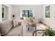 Bright living room featuring a cozy window seat and neutral-toned furniture and decor at 403 Mayodan Dr, Cary, NC 27511