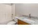 Bathroom featuring a shower-tub combo and modern vanity with granite countertops at 411 A Aversboro Rd, Garner, NC 27529