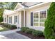 Charming home featuring manicured bushes and a sidewalk up to the front door at 411 A Aversboro Rd, Garner, NC 27529