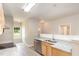 Well-lit kitchen featuring stainless steel appliances, a sink, and a view to the doorway to a living space at 411 A Aversboro Rd, Garner, NC 27529