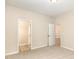 Comfortable carpeted bedroom with an open doorway to an attached bathroom, providing convenience at 411 B Aversboro Rd, Garner, NC 27529