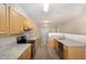 Well-lit kitchen featuring granite countertops, stainless steel appliances, and modern luxury vinyl plank flooring at 411 B Aversboro Rd, Garner, NC 27529