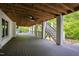 Open-air porch with wood flooring and a ceiling fan offers outdoor relaxation at 4237 Rowan St, Raleigh, NC 27609