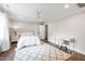 Bright bedroom with a plush rug, white furniture and a ceiling fan for added comfort at 4237 Rowan St, Raleigh, NC 27609
