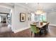 Elegant dining room with hardwood floors, custom lighting, and a built in server cabinet at 4237 Rowan St, Raleigh, NC 27609