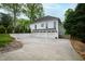 Spacious three-car garage with ample parking and a well-maintained driveway, set against lush greenery at 4237 Rowan St, Raleigh, NC 27609