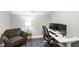 A comfortable office with an adjustable desk, ergonomic chair and cozy seating area at 4237 Rowan St, Raleigh, NC 27609