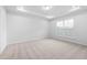 Bright bedroom with large window, neutral carpet, and recessed lighting provides a serene space at 433 Providence Springs Ln, Fuquay Varina, NC 27526