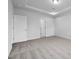 Spacious empty bedroom with plush carpeting, tray ceiling, and white walls at 433 Providence Springs Ln, Fuquay Varina, NC 27526