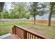 Spacious backyard, partially fenced with deck overlooking yard at 4513 Denfield St, Durham, NC 27704