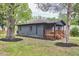 Charming home exterior with inviting front porch and landscaped yard at 4513 Denfield St, Durham, NC 27704