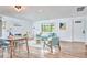 Open-concept living and dining area with abundant natural light and modern decor at 4513 Denfield St, Durham, NC 27704