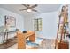 Bright office showcasing a stylish desk, bookshelves, modern decor and neutral color palette at 4513 Denfield St, Durham, NC 27704