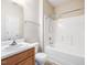 Well-lit bathroom featuring a vanity and a shower-tub combo at 522 Auburn Square Dr, Durham, NC 27713