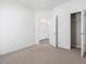 Bright bedroom with neutral carpet, closet and easy access to other rooms at 522 Auburn Square Dr, Durham, NC 27713