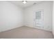Bedroom with carpeted floors and a door leading to a patio space at 522 Auburn Square Dr, Durham, NC 27713