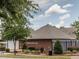 Auburn Swim Club building with brick facade, manicured bushes, and landscaping at 522 Auburn Square Dr, Durham, NC 27713