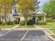 Exterior of home with sidewalks, trees, and a reserved parking space at 522 Auburn Square Dr, Durham, NC 27713