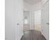 Hallway with access to multiple rooms and featuring wood-look flooring at 522 Auburn Square Dr, Durham, NC 27713