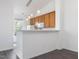 Kitchen with hardwood flooring and white breakfast bar and pendant lighting at 522 Auburn Square Dr, Durham, NC 27713