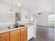 Open concept living space with kitchen and windowed living room at 522 Auburn Square Dr, Durham, NC 27713