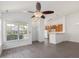 Open-concept living area with vaulted ceilings, modern floors, and bright kitchen at 522 Auburn Square Dr, Durham, NC 27713