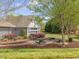 Outdoor community picnic area with tables, paved walkway, and surrounding greenery at 522 Auburn Square Dr, Durham, NC 27713