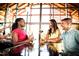 Upbeat bar scene with three people enjoying drinks at 524 Folk Song Way, Wendell, NC 27591