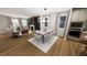 Open concept living/dining area with hardwood floors, neutral colors, lots of natural light and a fireplace at 524 Folk Song Way, Wendell, NC 27591