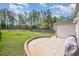 Spacious backyard with a concrete patio and a well-maintained lawn, great for outdoor activities at 528 Holden Forest Dr, Youngsville, NC 27596