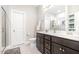 Modern bathroom with double sinks, stylish vanity, and a glass-enclosed shower at 528 Holden Forest Dr, Youngsville, NC 27596