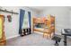 bedroom with bunk beds, plush carpet, and a window providing natural light at 528 Holden Forest Dr, Youngsville, NC 27596
