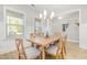 Bright dining room features a wooden table and chairs, wood floors, and ample natural light at 528 Holden Forest Dr, Youngsville, NC 27596
