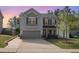 Charming two-story home with a gray exterior, inviting front porch, and well-manicured lawn at 528 Holden Forest Dr, Youngsville, NC 27596