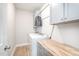 Convenient laundry room with washer, dryer, storage cabinets, and a folding countertop at 528 Holden Forest Dr, Youngsville, NC 27596