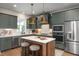 Gourmet kitchen features an island, stainless steel appliances, and ample cabinet space at 536 Folk Song Way, Wendell, NC 27591
