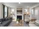 Inviting living room with a cozy fireplace, plush seating, and elegant decor creating a warm and stylish atmosphere at 536 Folk Song Way, Wendell, NC 27591