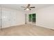 Bedroom with hardwood floors, a ceiling fan, and sliding doors leading to a deck at 5604 Groomsbridge Ct, Raleigh, NC 27612