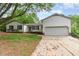 Charming two-story home featuring a two-car garage and a beautifully landscaped front yard at 5604 Groomsbridge Ct, Raleigh, NC 27612