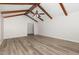 Large living room with exposed beams, hard wood floors and large windows at 5604 Groomsbridge Ct, Raleigh, NC 27612