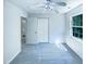 Bedroom with a ceiling fan, closet, and a window providing natural light at 5828 Brambleton Ave, Raleigh, NC 27610