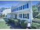 Charming two-story home with landscaped yard, covered front porch, and manicured bushes at 5828 Brambleton Ave, Raleigh, NC 27610
