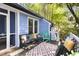Inviting deck with comfortable seating, outdoor rug, grill, and a view of the private backyard at 6 Landover Ct, Durham, NC 27713