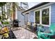 Inviting deck with comfortable seating, outdoor rug, grill, and a view of the private backyard at 6 Landover Ct, Durham, NC 27713