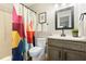 Bathroom features a tub and shower, toilet, vanity and sink with a colorful shower curtain at 6 Landover Ct, Durham, NC 27713