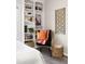 Bright bedroom features a bookshelf, accent chair, hardwood floors, and natural lighting at 6 Landover Ct, Durham, NC 27713
