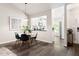 Dining area with modern black chairs next to an open kitchen at 6 Landover Ct, Durham, NC 27713