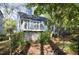 Charming home with a deck, featuring white lattice and nestled amongst mature trees at 6 Landover Ct, Durham, NC 27713